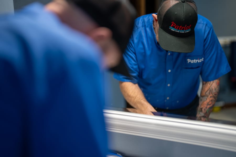 Professional plumber upgrading bathroom plumbing as part of a residential renovation.