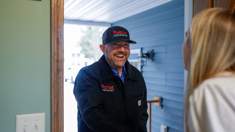 Patriot Plumbing technician arriving to provide professional drain cleaning service.