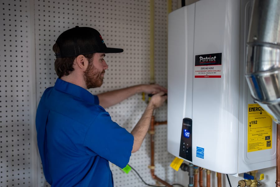 Installed tankless water heater system providing on-demand hot water.